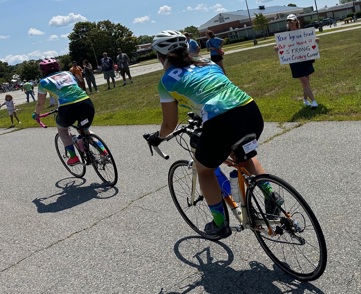 A group of people riding bicycles
AI-generated content may be incorrect.
