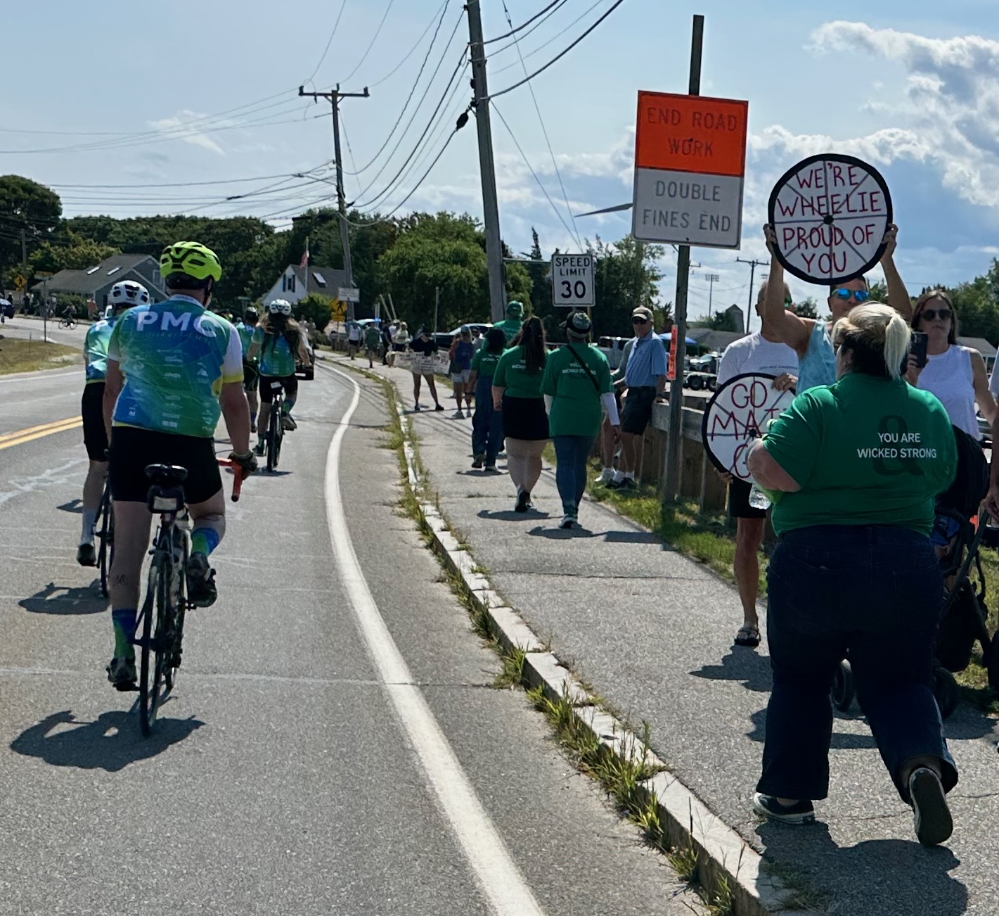 A group of people on bicycles with signs
AI-generated content may be incorrect.