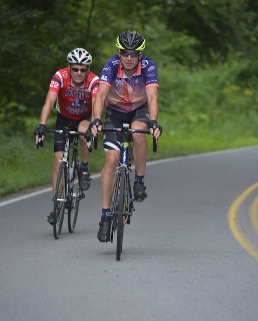 A group of people riding bikes on a road
Description automatically generated with low confidence