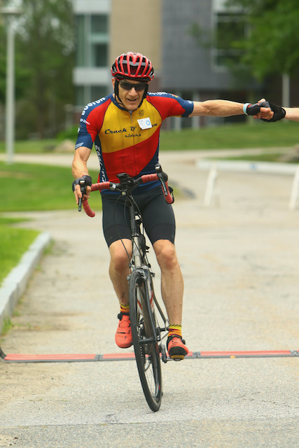 A person riding a bicycle
Description automatically generated with medium confidence