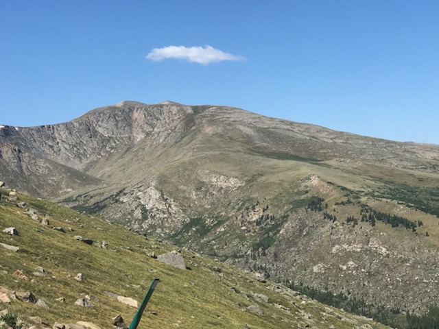 A picture containing mountain, outdoor, grass, nature
Description automatically generated
