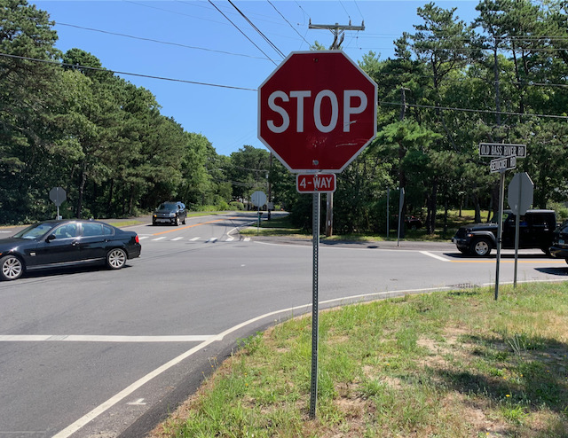 A stop sign on the side of a road
Description automatically generated with medium confidence